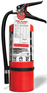 Fire extinguisher with inspection tag. Portable ABC or multi-pu
